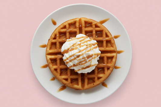 belgian waffle with whip cream & caramel on top with the background been #c85393